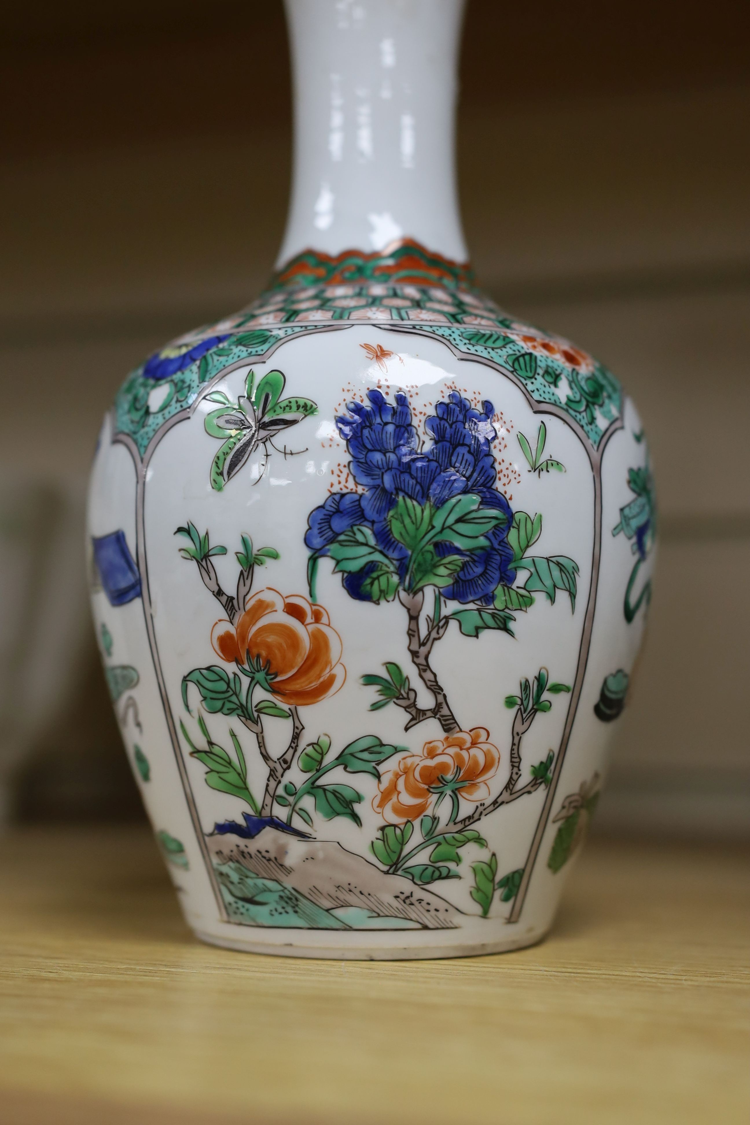 A pair Samson of Paris vases in the Chinese famille verte style and a Chinese Qianlong famille rose garlic neck vase with blue panelling motif, tallest 26cm